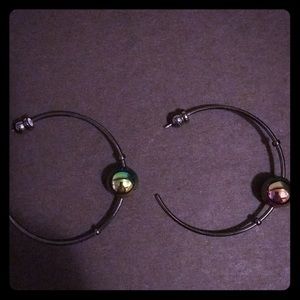 Black rhodium hoop earrings with iridescent ball